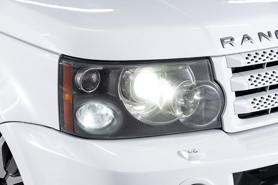 A closeup of the headlight on a Land Rover at Repair One