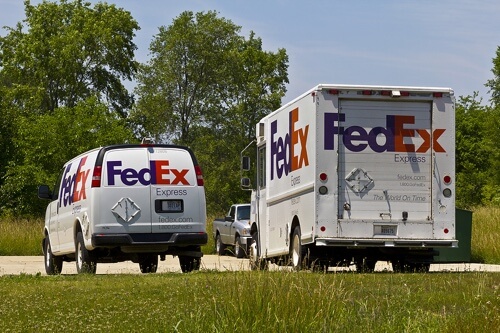 Repair One Auto Fleet Service Provider in Klein, TX; image of FedEx fleet van and truck parked in parking lot on sunny day