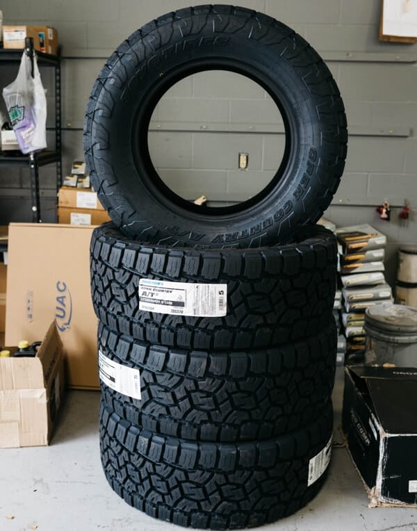 image of 4 tires for sale on display in the shop area at Repair One in The Woodlands Tx