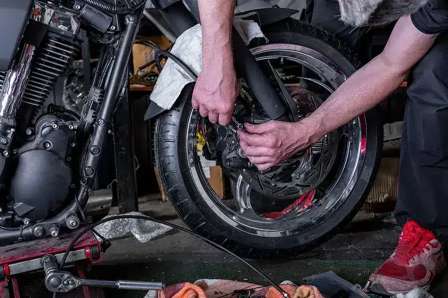 Repair One technician checking a motorcycle as part of the state inspection