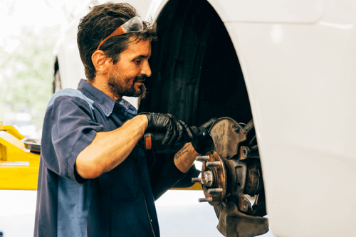 3 Things That Usually Go Wrong in Your Brakes | Repair One in The Woodlands, TX. Image of a car mechanic checking and repairing a vehicle’s disc brake.