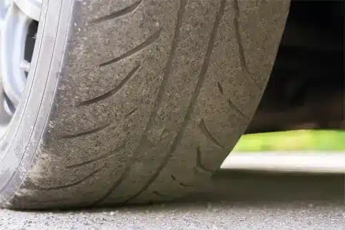 3 Questions Often Asked About Tire Change | Repair One in Spring, TX. Closeup image of worn-out tire. This is a sign that it’s time to change tires.