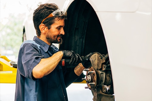 A mechanic doing Regular Brake Inspections in The Woodlands, TX | Repair One Woodlands