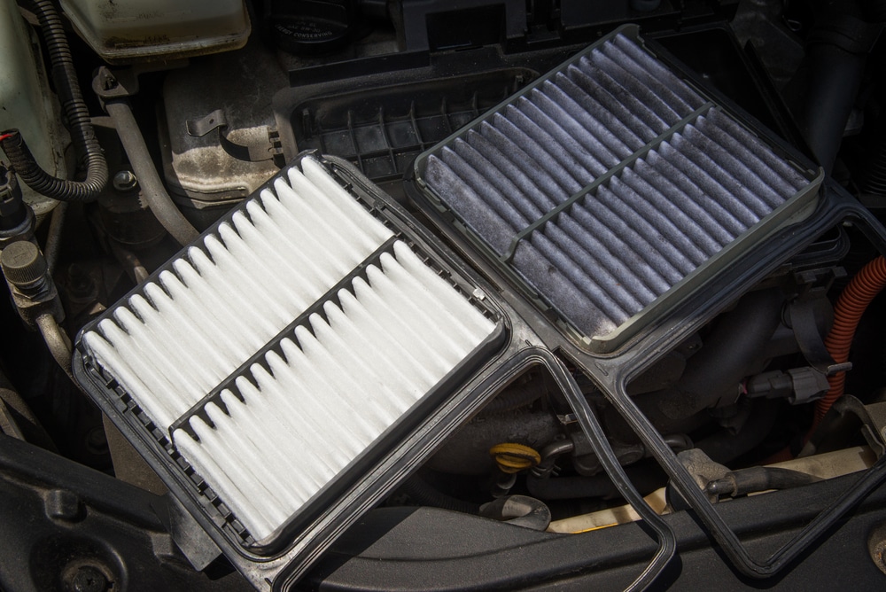 Vehicle Air Filter Services in Spring, TX | Repair One. Close up image of a clean and dirty engine air filter.