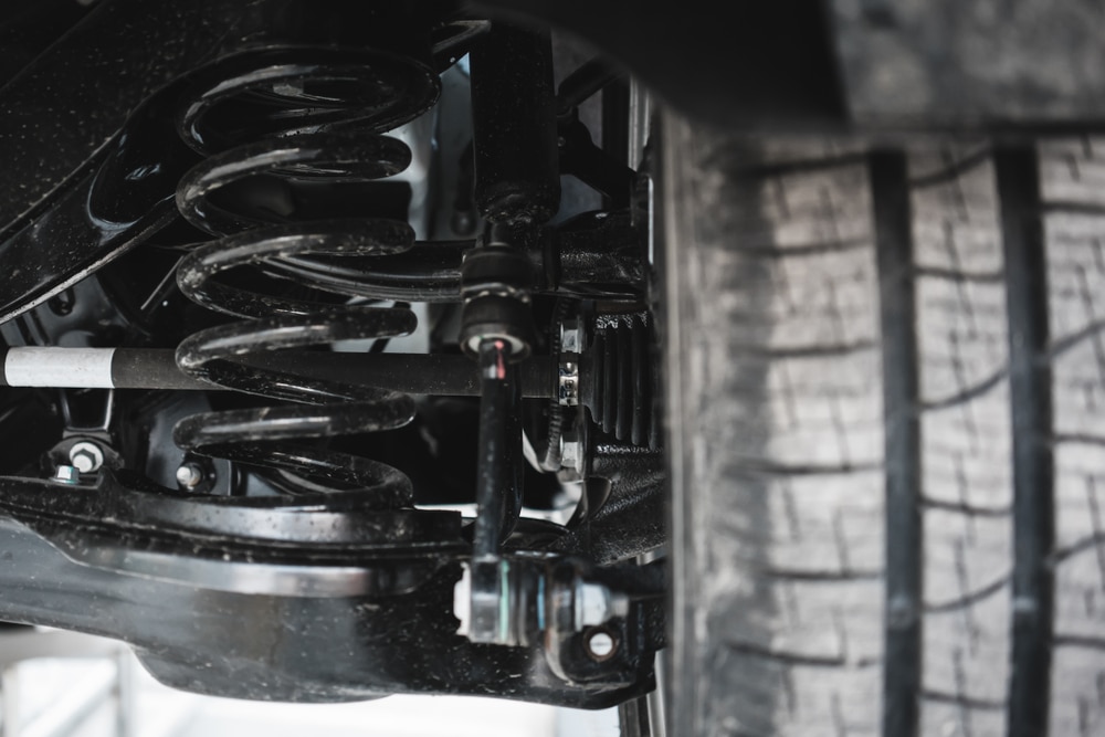 Top Suspension Repair Services in Klein and The Woodlands, TX | Repair One | Vehicle Care. SUV car suspension system.