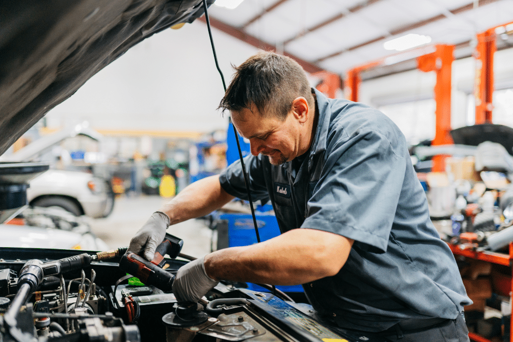Blog 1 certified auto technicians, auto repair in The Woodlands, TX at Repair One Tire & Auto. A dedicated mechanic performing engine diagnostics and repairs, ensuring optimal vehicle performance and reliability.