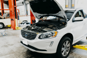 Why Texas Drivers Should Check Their Brakes Before Spring Rain Hits 2 Vehicle Inspection in The Woodlands TX At Repair One Tire & Auto. Vehicle with open hood for vehicle inspection